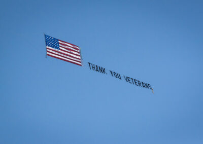 Flag with Thank you Veterans flying
